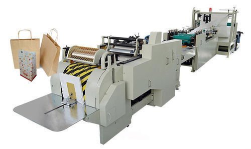 Paper bag making machine with handle unit and sample bags