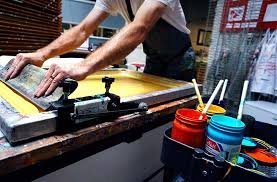 Hand screen printing with squeegee and ink pots